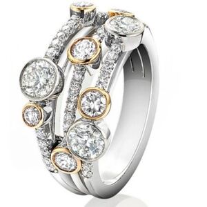 CZ RING TWO TONED TRIPLE BAND . THIS RING REALLY SPARKLES.
